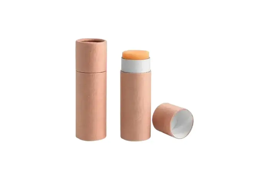 Pink tubes with one open cap and a raised orange stick.