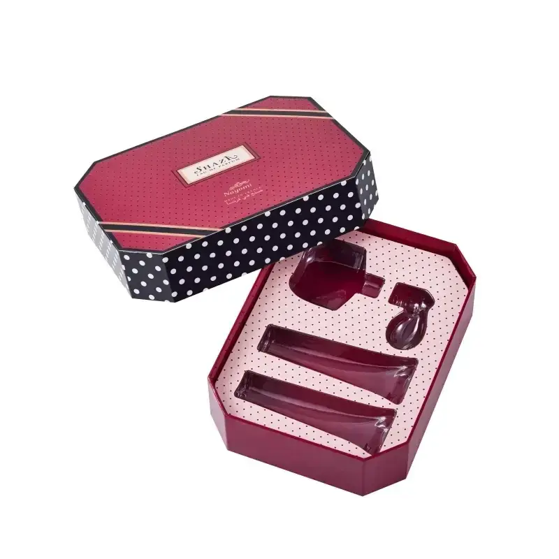 Pink and black patterned box with a fitted divided insert.
