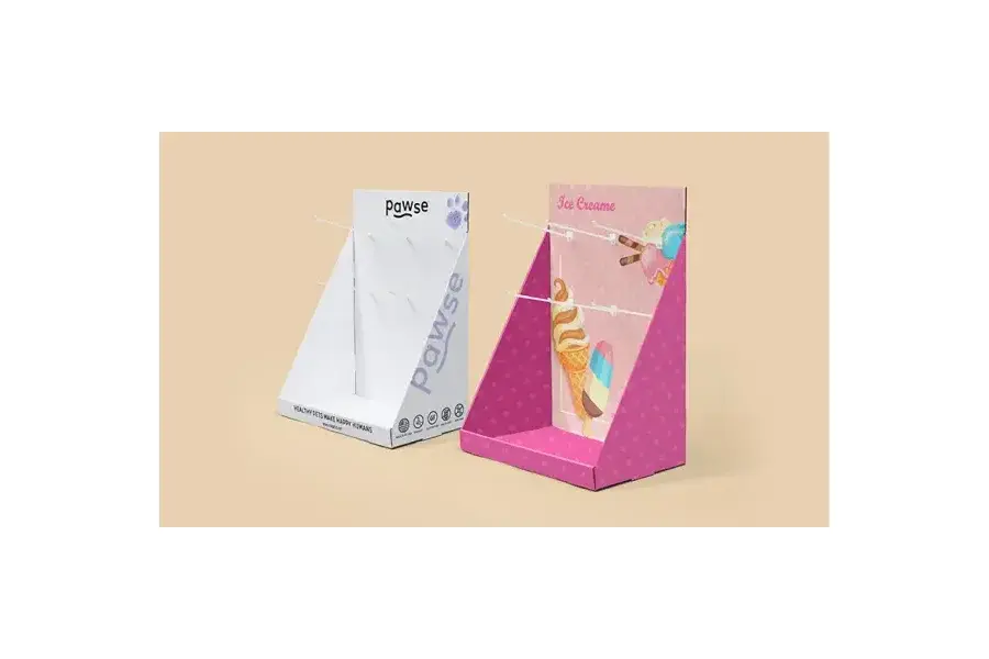Pink and white angled countertop displays with upright back panels.