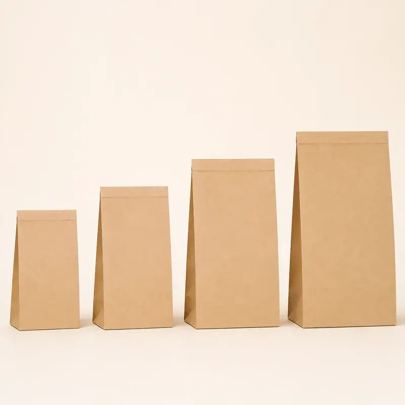 Four plain kraft paper bags in increasing sizes.