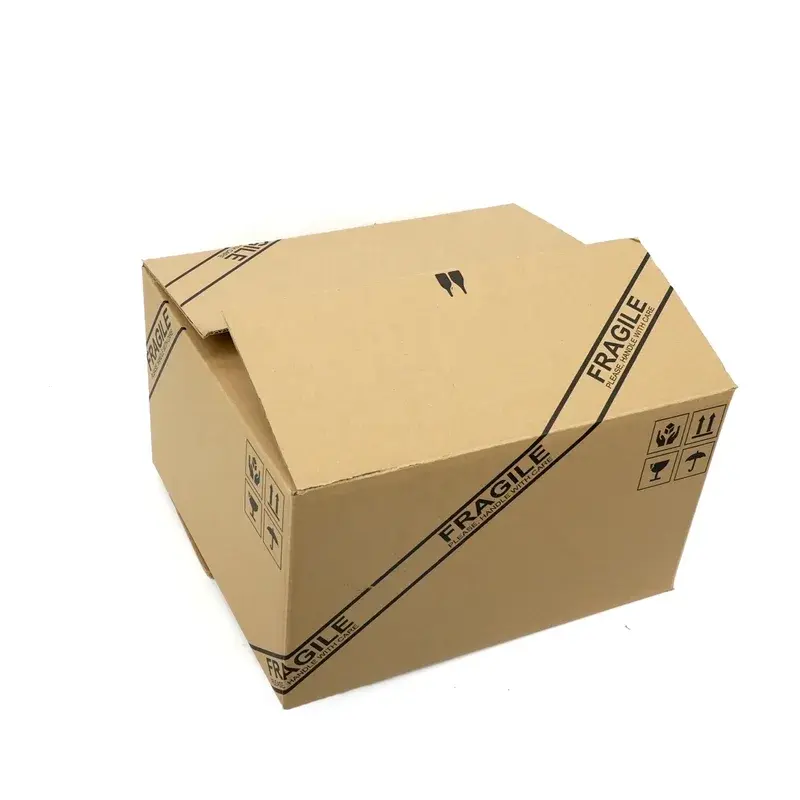 Closed kraft shipping box with black printed markings.