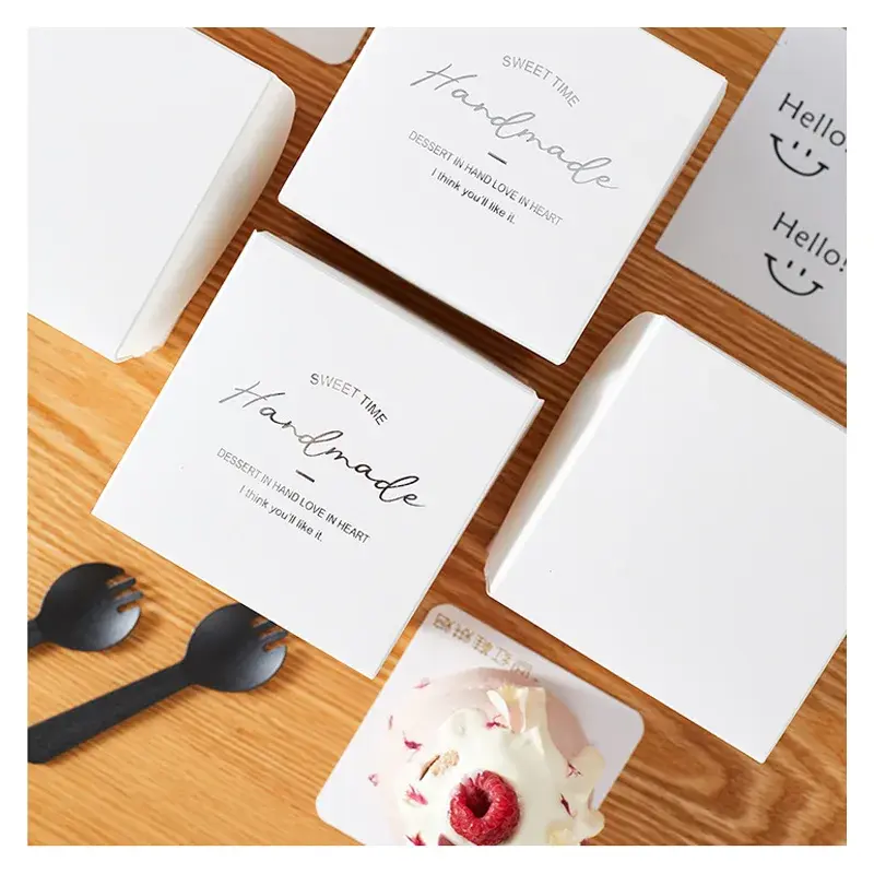 White printed thank-you cards arranged beside ribbon.