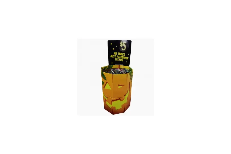 Orange pumpkin-printed display bin filled with wrapped treats.