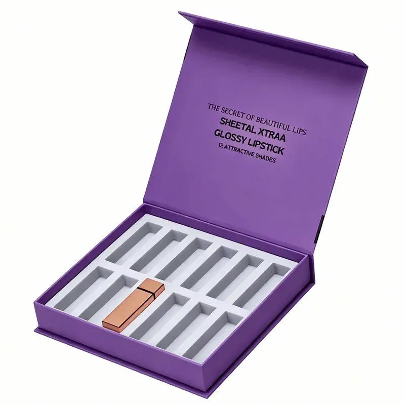 Open purple gift box with a white compartmented lipstick insert.
