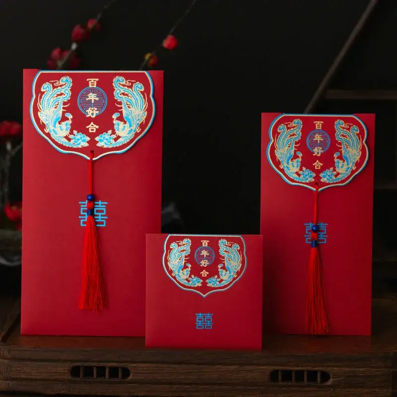 Three upright red envelopes with illustrated flap panels.