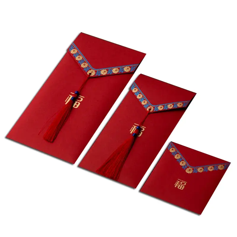 Red envelopes in different sizes with decorative tassel closures.