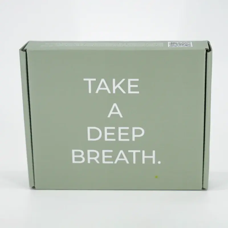 Sage-green mailing box with large white lettering.
