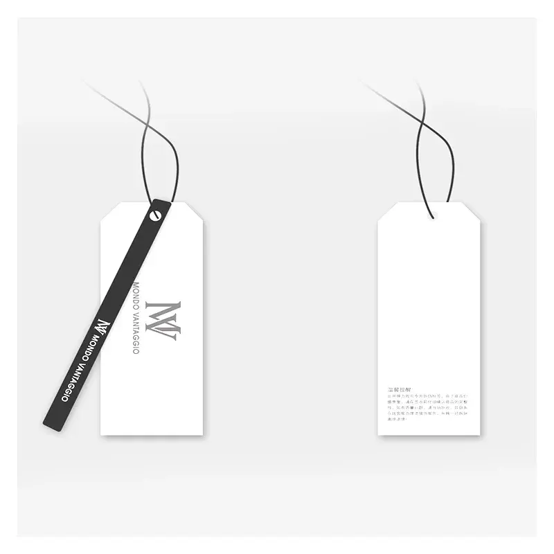 White and black hanging tags with fine cords and printed lettering.