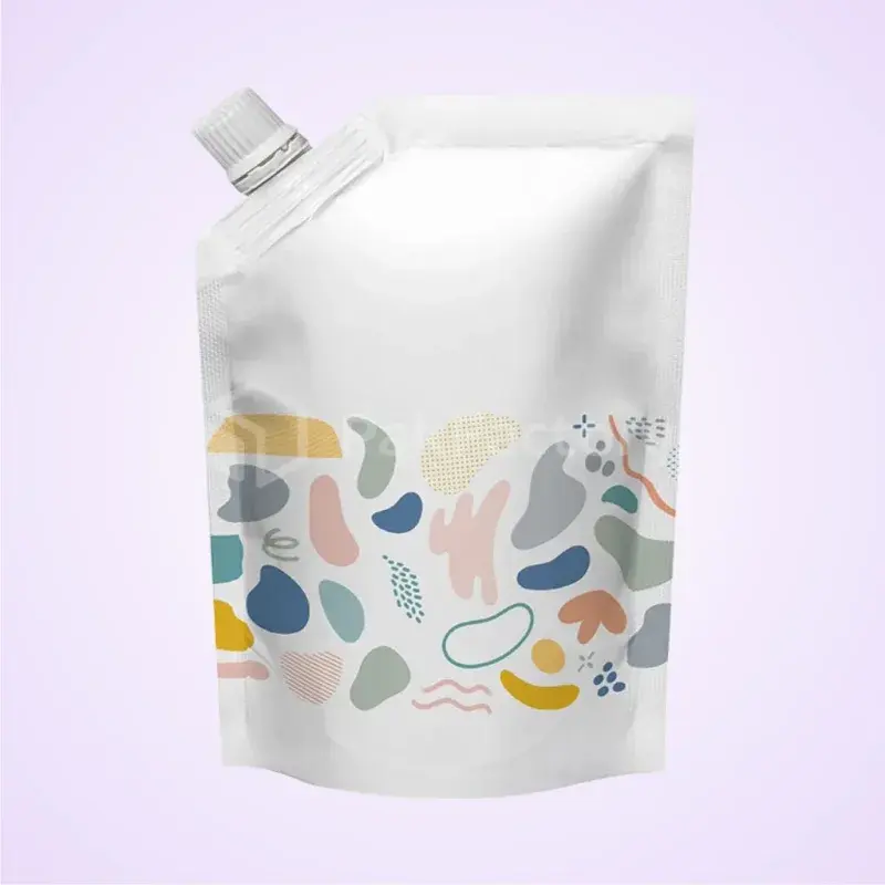 White pouch with a corner spout and colorful abstract graphics.