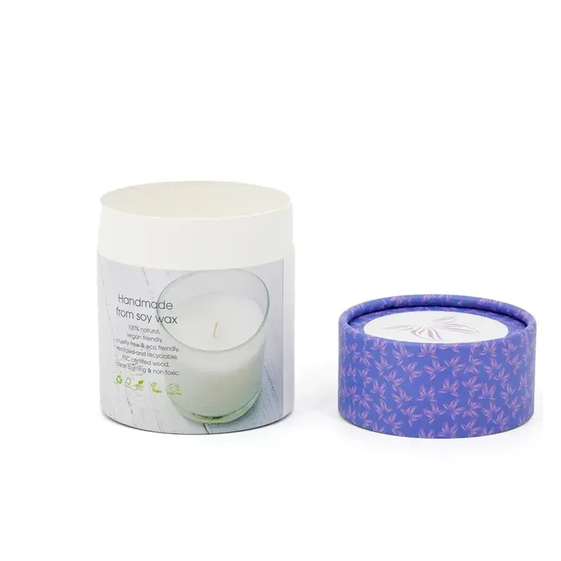 White printed tube beside its detached purple patterned cap.