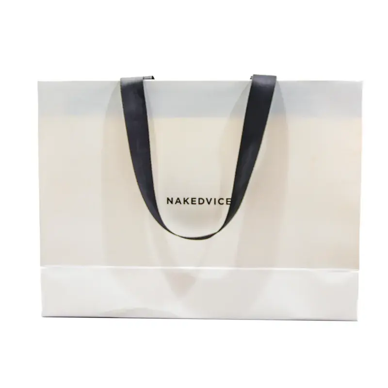 Front view of a white shopping bag with black ribbon handles.