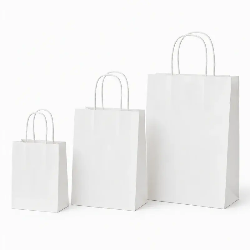 Three white paper bags in different sizes with twisted handles.