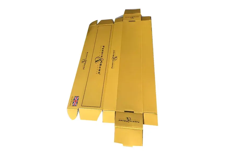 Long yellow carton blank laid flat with fold lines visible.