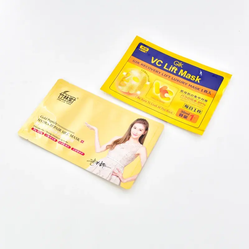 Yellow face mask pouches with printed lettering and a portrait.